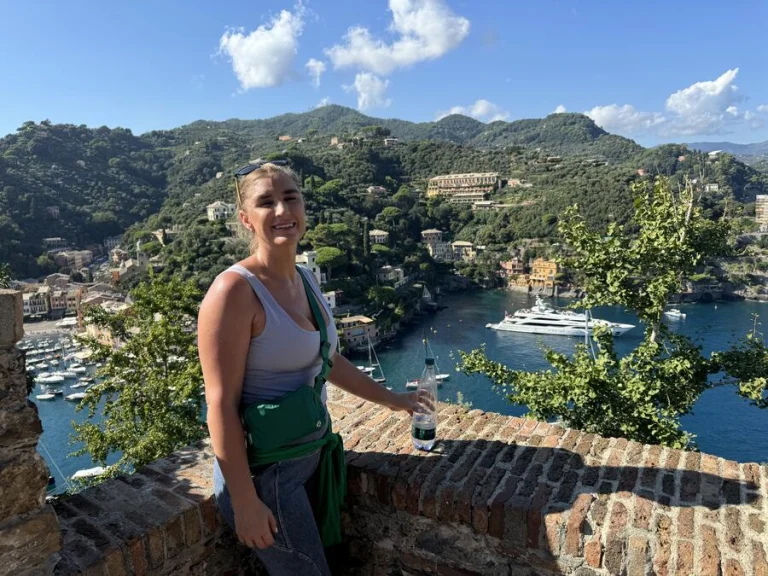Ivy on a terrace above Portofino harbour, with yachts and pastel houses below